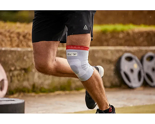 Бандаж для коліна Reebok Speedwick Knee Support розмір M, біло-червоний